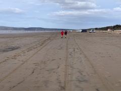 Walking back down Brean beach - with the wind well and truly in our faces